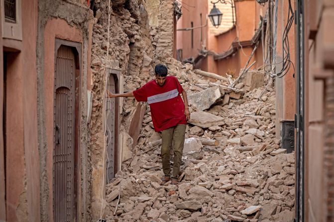 A Marrakech resident navigates through the rubble on September 9.