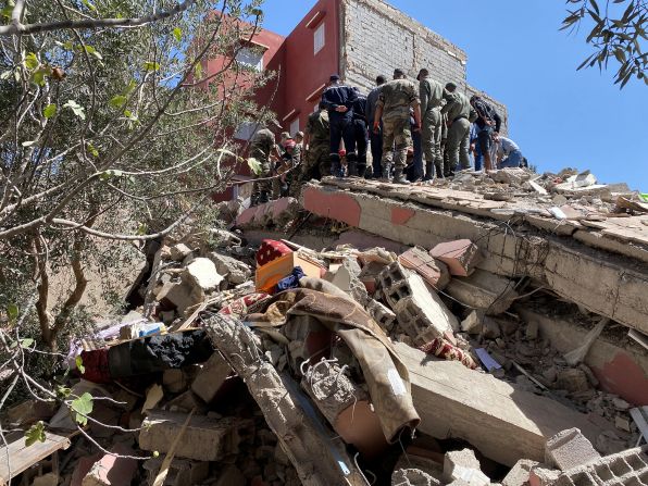 Rescue workers search through rubble in Amizmiz on September 9.