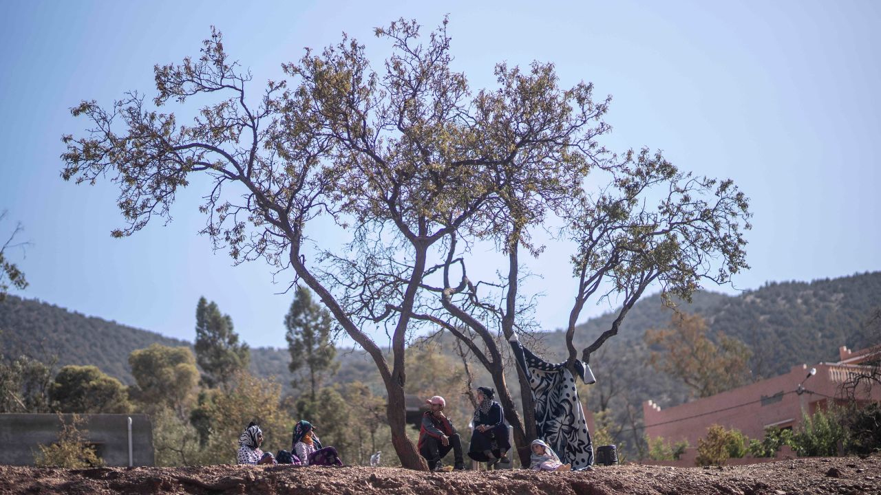 People take shelter under trees after their home was damaged by the earthquake, in Ouargane village, near Marrakech.