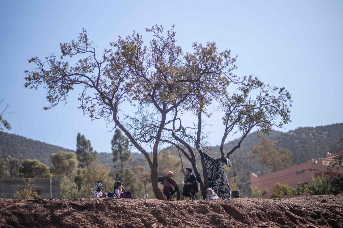 People take shelter under trees after their home was damaged by the earthquake, in Ouargane village, near Marrakech.