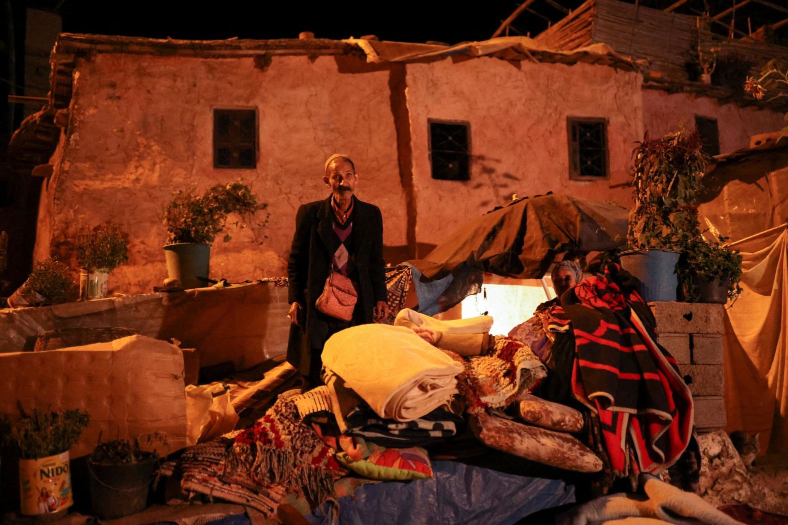 A man stands near his damaged house in Moulay Brahim on September 9.