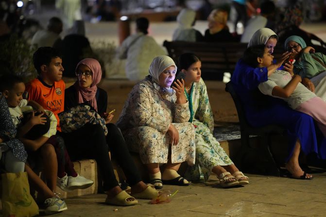 People take shelter in a Marrakech park on September 9.
