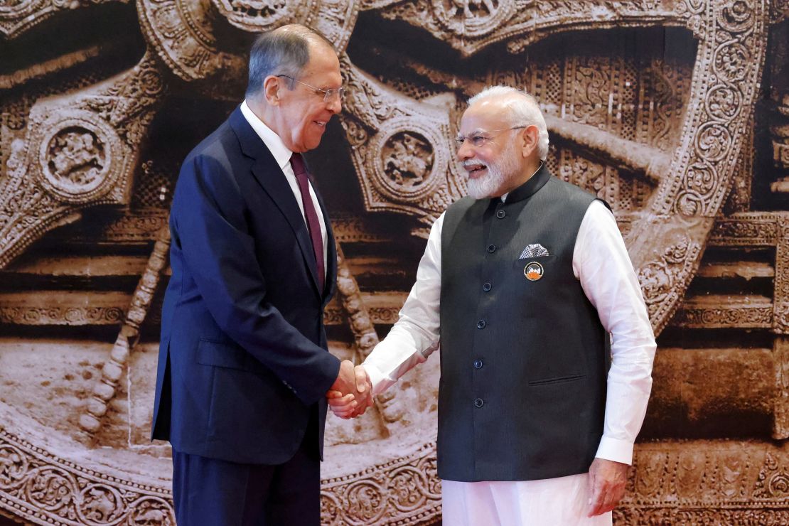 India's Prime Minister Narendra Modi and Russian Foreign Minister Sergei Lavrov shake hands ahead of the G20 summit. 