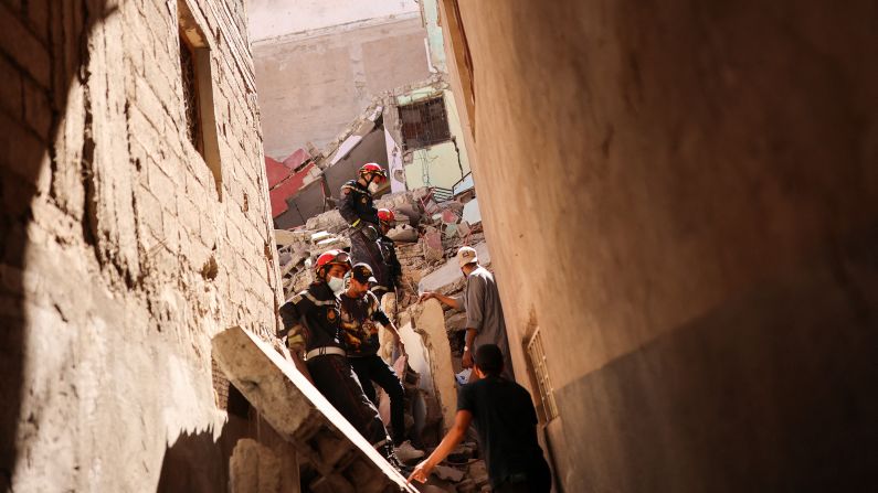 Emergency workers search a destroyed building in Amizmiz on September 10.