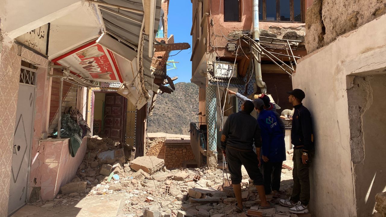 Residents of Moulay Brahim look at the remains of a hotel where Sami Sensis parents were staying when the earthquake struck.