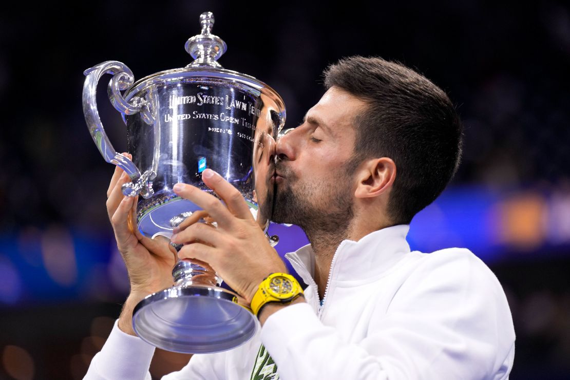 Novak Djokovic, of Serbia, kisses the championship trophy after defeating Daniil Medvedev, of Russia, in the men's singles final of the U.S. Open tennis championships, Sunday, Sept. 10, 2023, in New York. (AP Photo/Manu Fernandez)