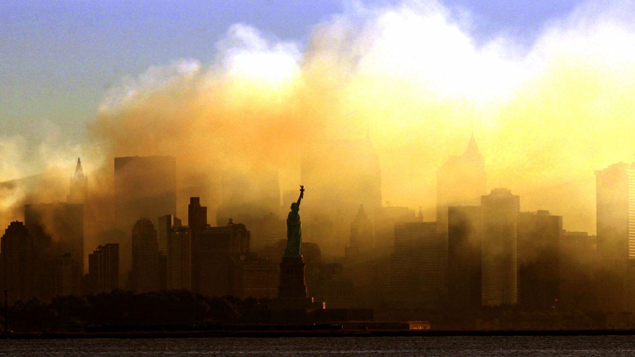 FILE - This Saturday morning, Sept. 15, 2001 file picture shows the Statue of Liberty from a vantage point in Jersey City, N.J., as the lower Manhattan skyline is shrouded in smoke following the Sept. 11 terrorist attacks on the World Trade Center in New York. (AP Photo/Dan Loh)