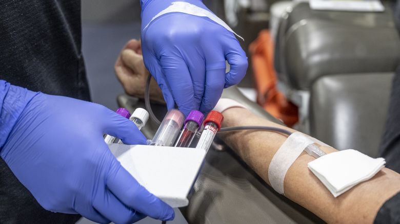 A nurse fills test tubes with blood to be tested during an American Red Cross bloodmobile in Fullerton, CA on Thursday, January 20, 2022.
