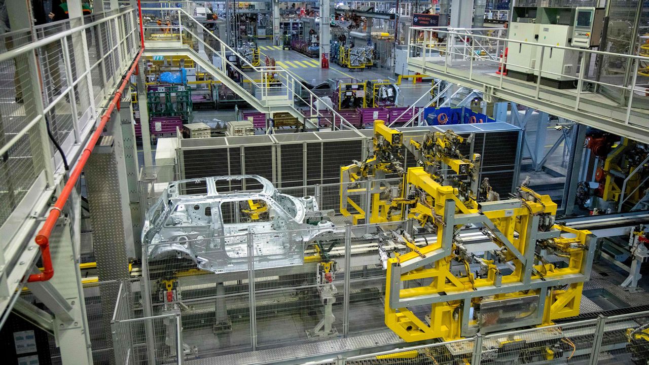 Robots work on the Mini production line at the BMW plant in Cowley, near Oxford.