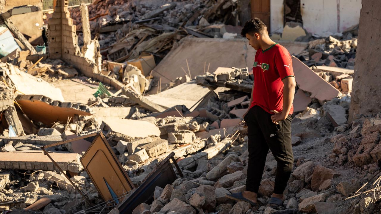 A man looks at the rubble of homes in the village of Talat N'Yacoub, south of Marrakech, on Monday.
