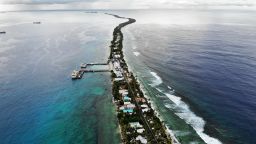 An aerial view of a strip of land between the Pacific Ocean (R) and lagoon on November 25, 2019 in Funafuti, Tuvalu. 
