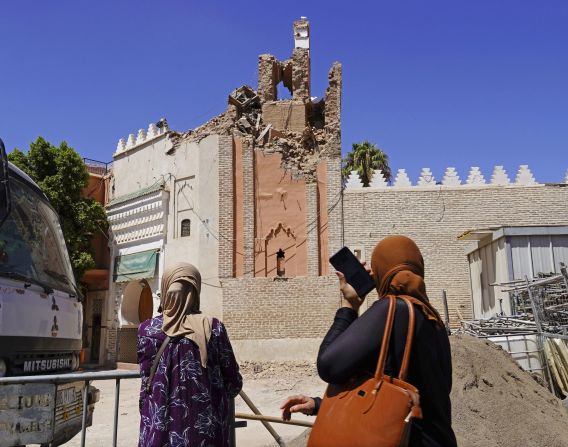 Women look up at the damaged Kharbouch Mosque in Marrakech on September 10.