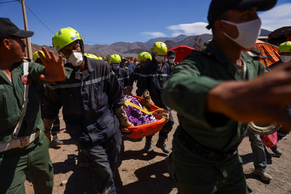 Rescue workers carry the body of an earthquake victim in Talat N'yaaqoub, Morocco, on September 11.