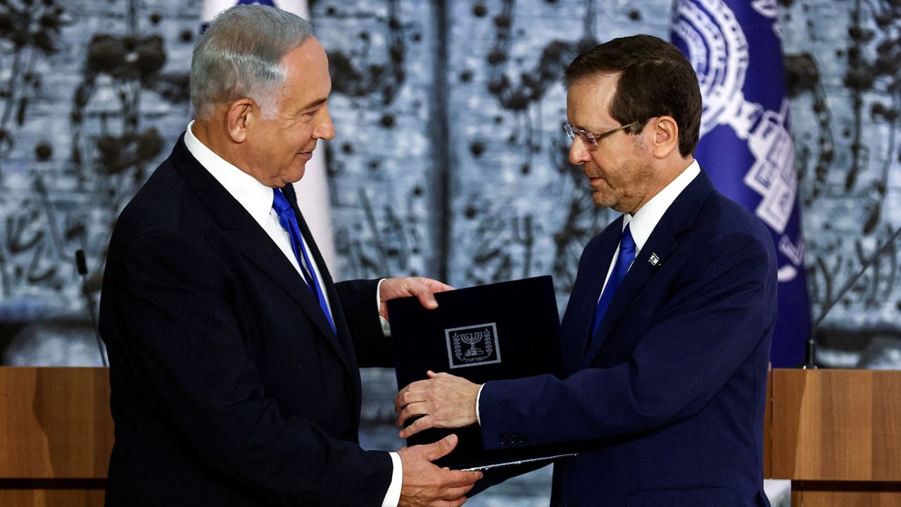 Israel President Isaac Herzog hands Benjamin Netanyahu the mandate to form a new government in November 2022.
