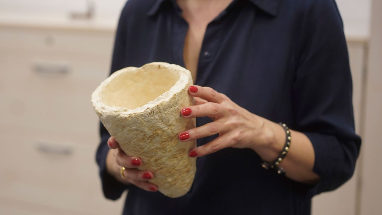 Vera Meyer, a scientist at the Berlin Institute of Biotechnology, holds a vessel made of scale sponge. The institute hopes to produce clothing, packaging and building material from fungal cultures.