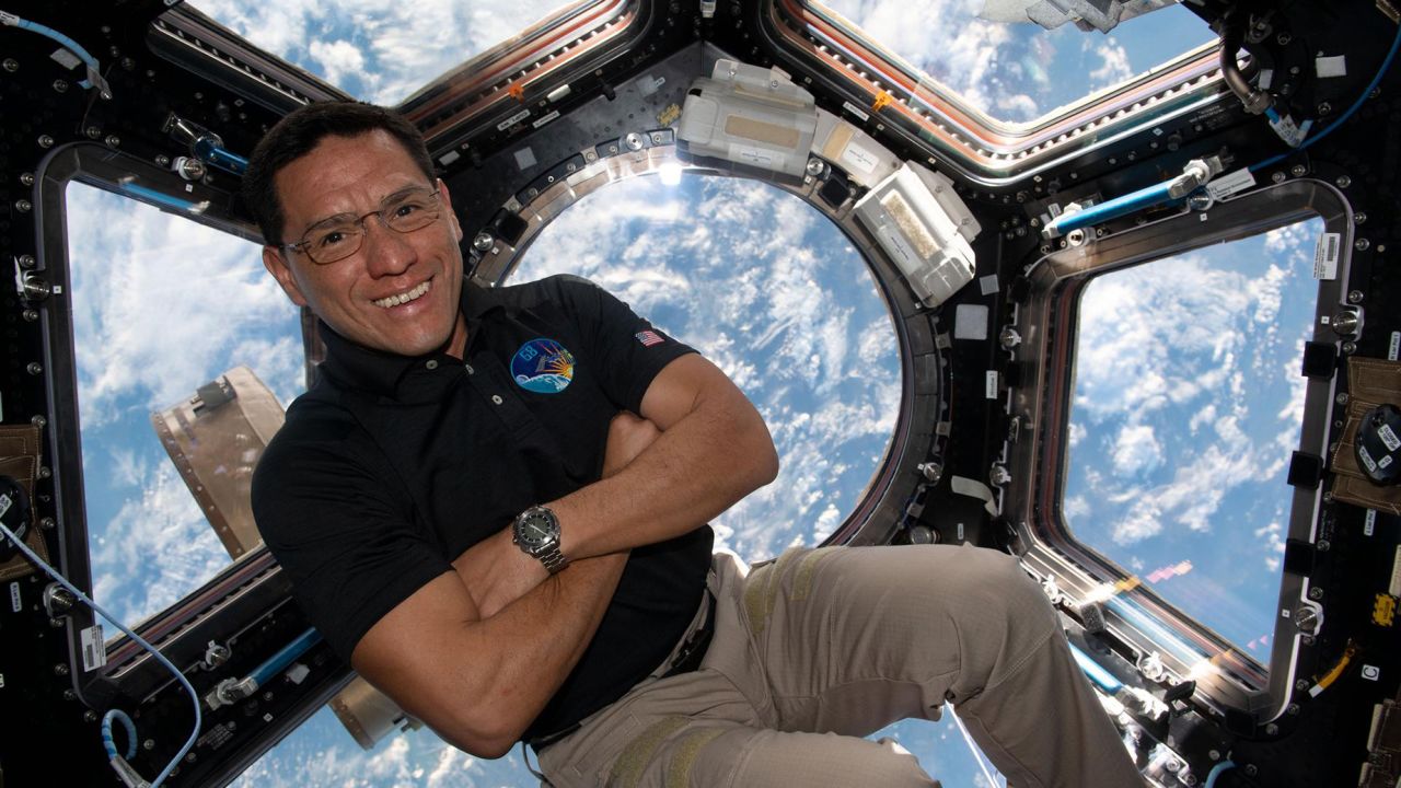 iss068e017867 (Oct. 1, 2022) --- NASA astronaut and Expedition 68 Flight Engineer Frank Rubio is pictured inside the cupola, the International Space Station's "window to the world," as the orbiting lab flew 263 miles above southeastern England.