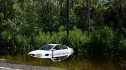 A car is seen downed on the side of a road in Crystal River, Florida on August 31, 2023, after Hurricane Idalia made landfall. Idalia barreled into the northwest Florida coast as a powerful Category 3 hurricane on Wednesday morning, the US National Hurricane Center said. "Extremely dangerous Category 3 Hurricane #Idalia makes landfall in the Florida Big Bend," it posted on X, formerly known as Twitter, adding that Idalia was causing "catastrophic storm surge and damaging winds." 