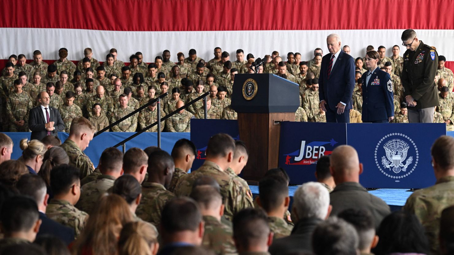 President Joe Biden bows his head during remarks to service members, first responders, and their families on the 22nd anniversary of the September 11, 2001, terrorist attacks, at Joint Base Elmendorf-Richardson in Anchorage, Alaska, on September 11, 2023.