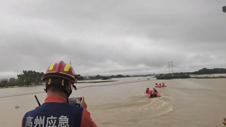 Members of an emergency force search for escaped crocodiles on boats in Maoming.