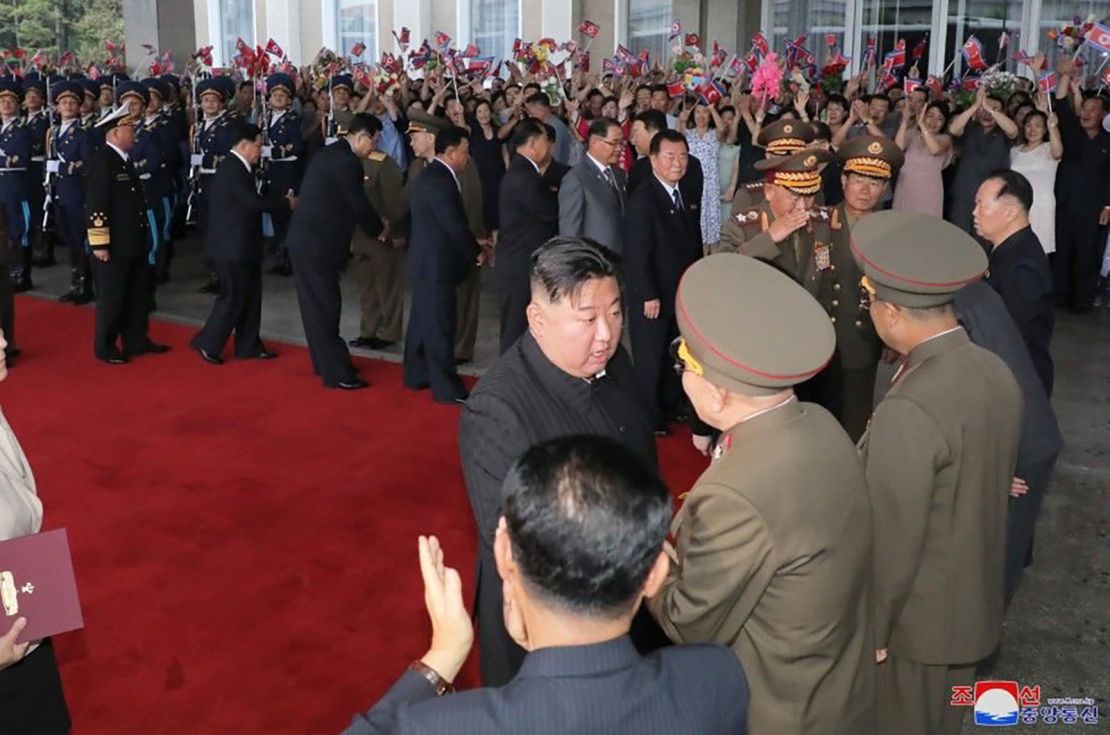 Onlookers cheer and wave as Kim Jong Un departs the North Korean capital Pyongyang.