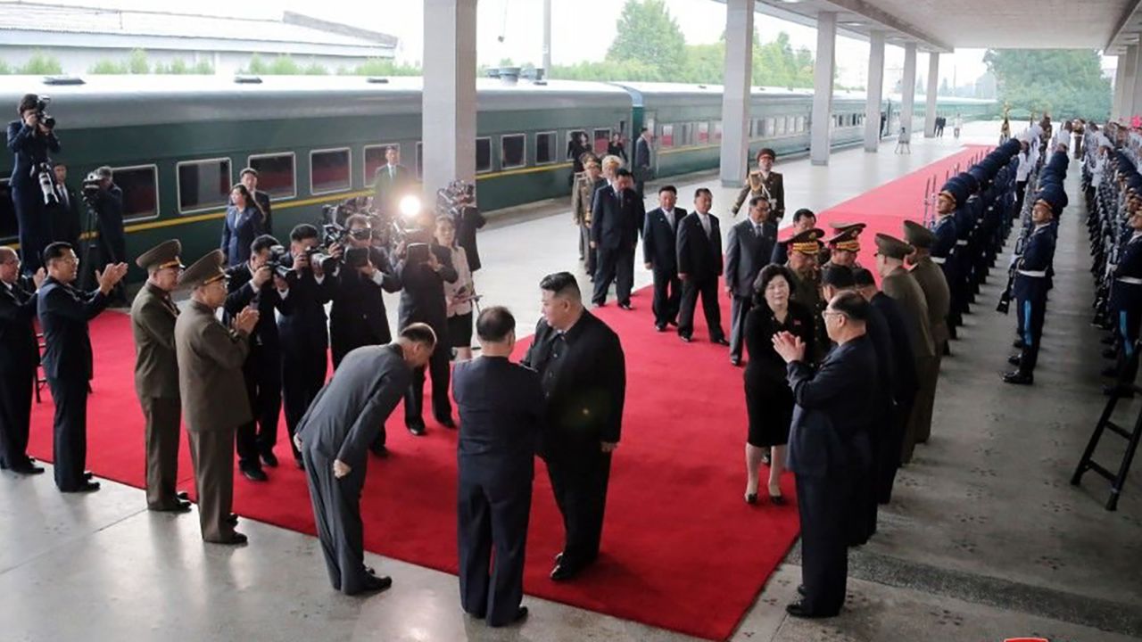 Kim shakes hands with North Korean officials ahead of his trip to Russia and an expected meeting with Vladimir Putin.