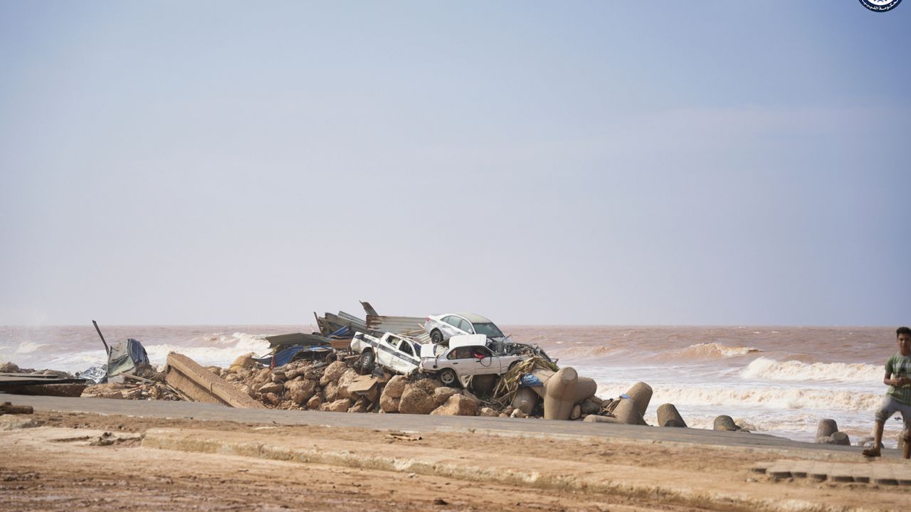 Cars are piled on the sea bank in Derna, Libya, on Monday, Sept. 11, 2023, after being carried by floodwaters.