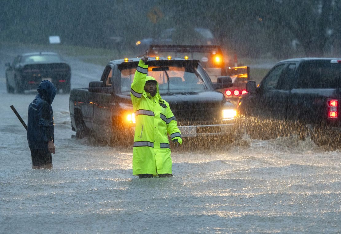 Drivers tried to cross a flooded street Monday in Leominster, Massachusetts, on September 11, 2023.