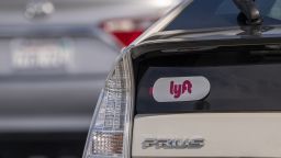 Lyft signage on a vehicle as it exits the ride-sharing pickup at San Francisco International Airport in San Francisco, California, U.S., on Thursday, Feb. 3, 2022. Lyft Inc. is scheduled to release earnings figur