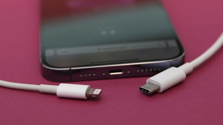 10 September 2023, Berlin: An iPhone 14 Pro with a Lightning cable (left) and a USB-C cable (right). Apple will most likely replace its in-house Lightning connector with USB-C next Tuesday after the European Union decided that phone manufacturers must use the USB-C standard by the end of 2024. 