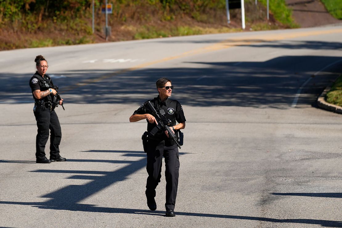 Law enforcement officers stand guard as the search for escaped convict Danelo Cavalcante continues Tuesday in Pennsylvania.