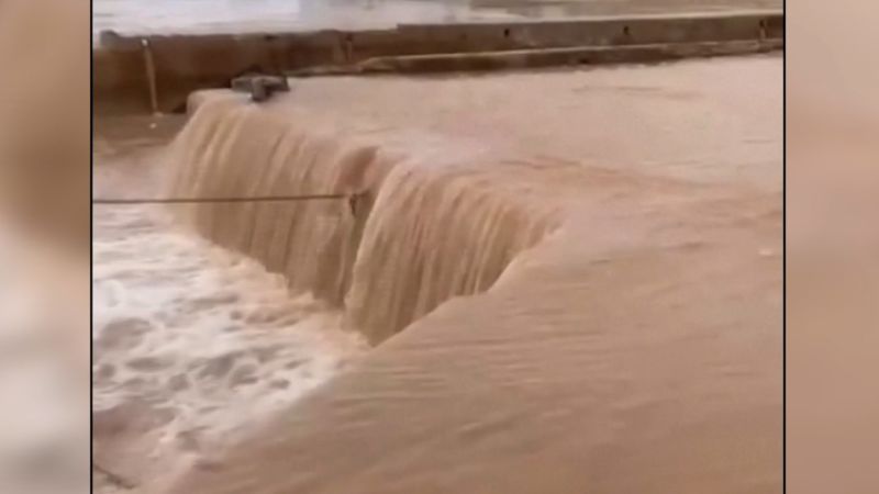 shows water gushing through port as 8 months worth of rain falls on Libya