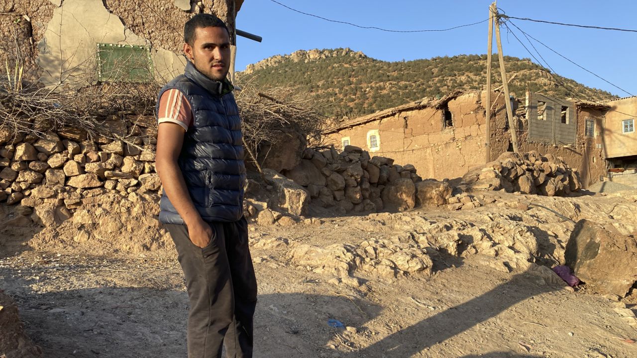 Hakim Idlhousein stands near the rubble of his house, in the village of Tinzert, in Morocco, which was destroyed by the quake.