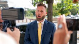 Infowars host Owen Shroyer speaks to reporters outside the E. Barrett Prettyman US Federal Courthouse on Tuesday, September 12, in Washington, DC. 