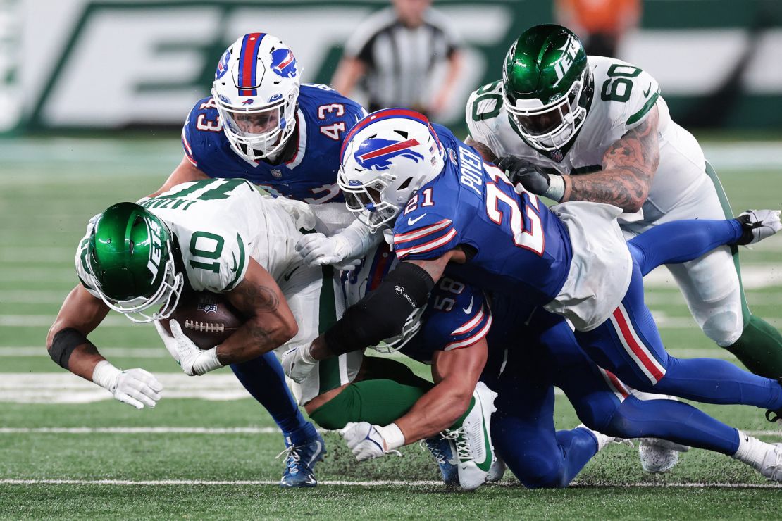 Sep 11, 2023; East Rutherford, New Jersey, USA; New York Jets wide receiver Allen Lazard (10) is tackled by Buffalo Bills safety Jordan Poyer (21) and linebacker Terrel Bernard (43) during the second half at MetLife Stadium. Mandatory Credit: Vincent Carchietta-USA TODAY Sports