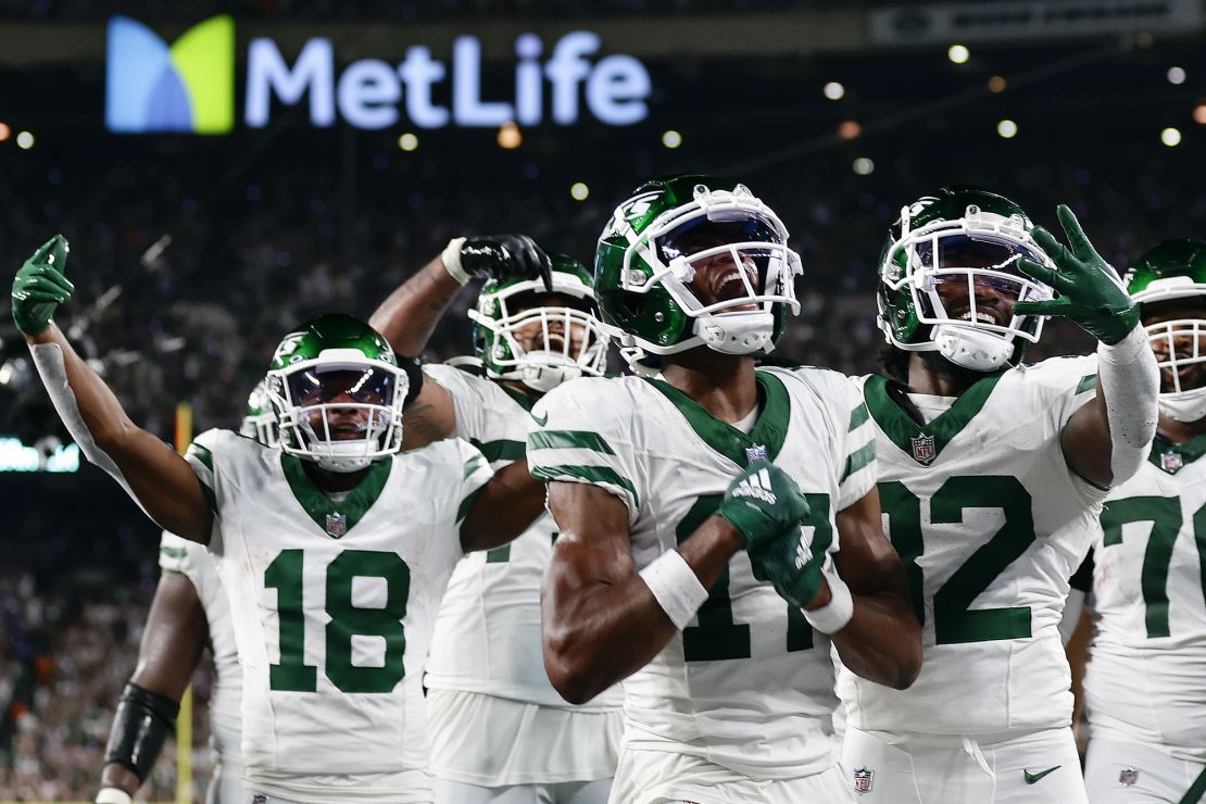 New York Jets wide receiver Garrett Wilson (17) celebrates with teammates after catching a pass for a touchdown against the Buffalo Bills during the fourth quarter of an NFL football game, Monday, Sept. 11, 2023, in East Rutherford, N.J. (AP Photo/Adam Hunger)