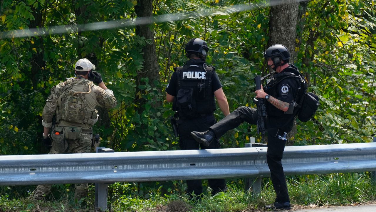 Officers enter the woods amid the search for Danelo Cavalcante in Pottstown Tuesday.