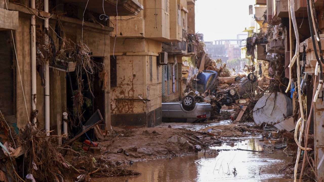 Overturned cars lay among other debris caused by flash floods in Derna, eastern Libya, on September 11, 2023. 