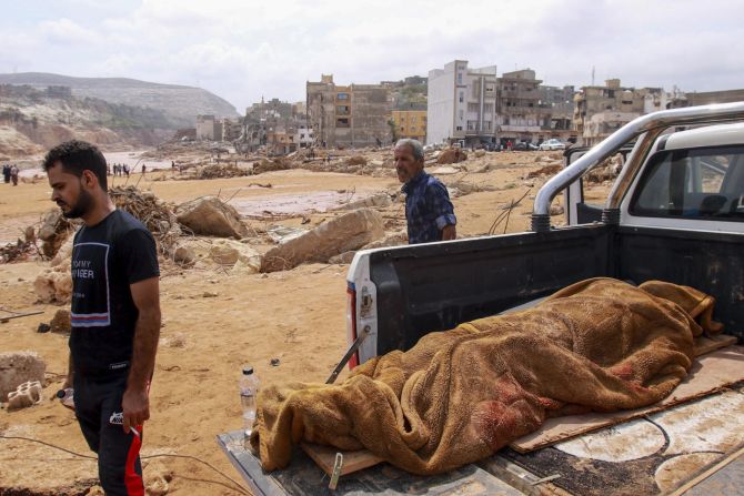 The body of a flood victim lies in the back of a pickup truck in Derna on September 11.