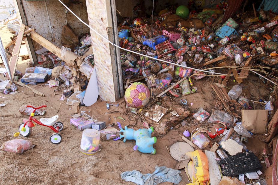 Toys are strewn across the ground at a damaged store in Derna on September 11.