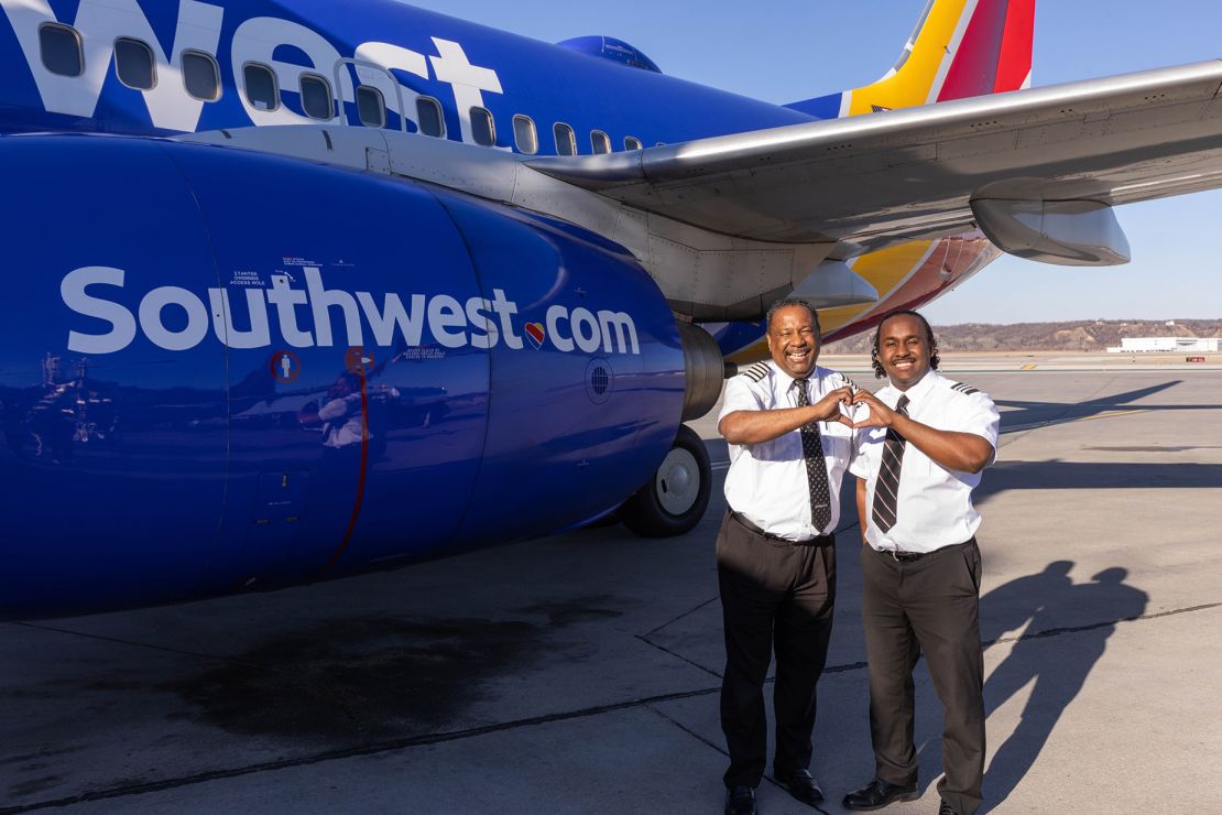 The Flowers men pictured by a Southwest aircraft.