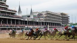 In this May 2023 photo, Javier Castellano, atop Mage, third from left, is seen with others behind the pack as they make the first turn while competing in the 149th running of the Kentucky Derby horse race at Churchill Downs Saturday, May 6, 2023, in Louisville, Kentucky.