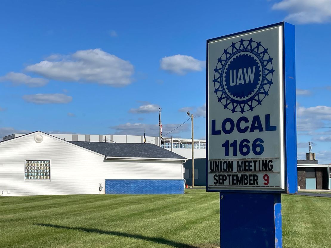 The EV battery plant being built by Stellantis and Samsung in Kokomo, in the background, is right across the street from one of the United Auto Workers union halls in the town where current unionized factories could be threatened by the shift to EVs.