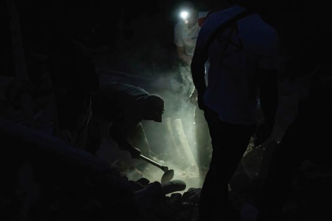 Rescuers dig through rubble in Imi N'Tala on September 12.
