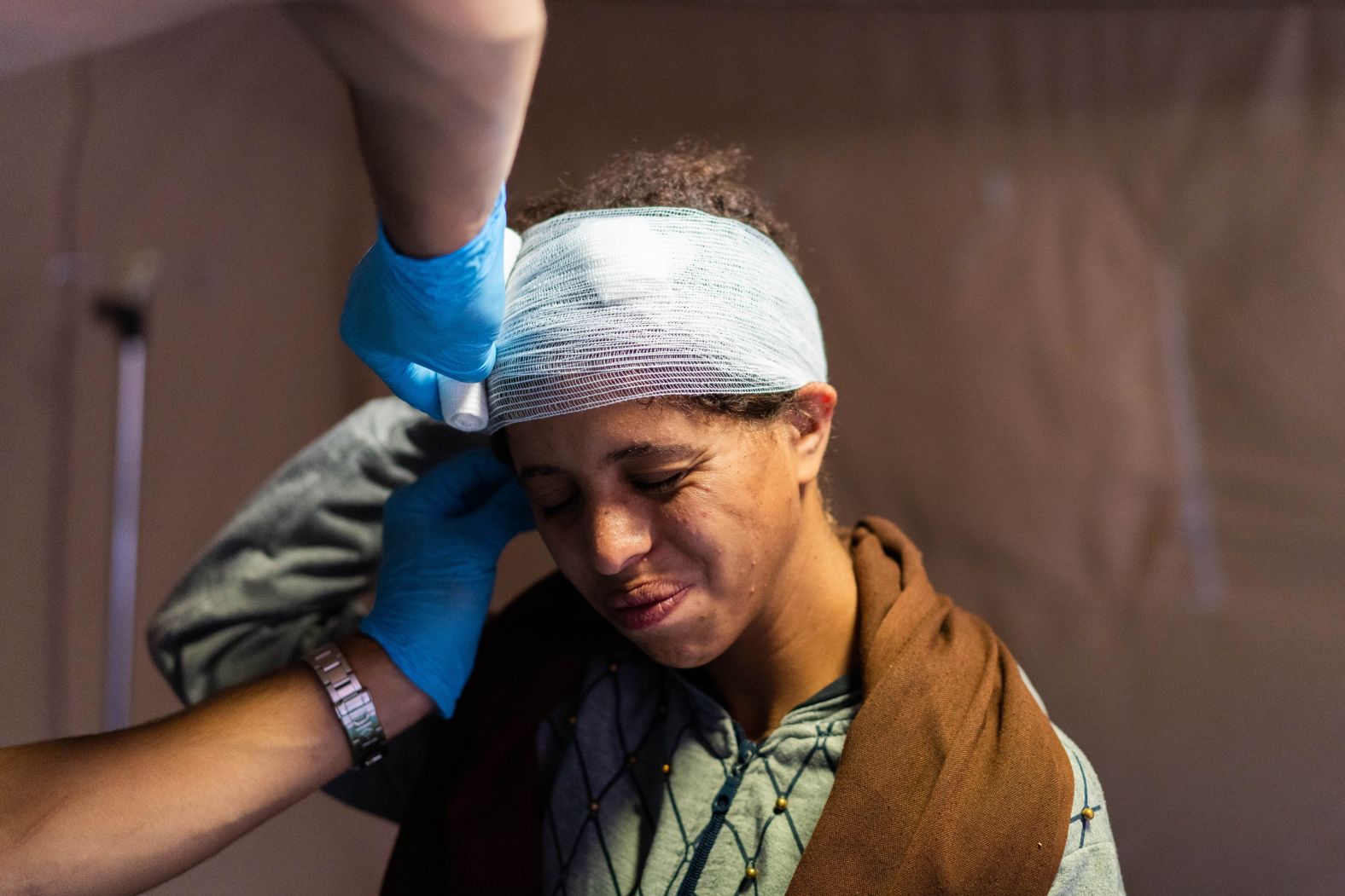 A doctor treats a patient at a military hospital in Asni on September 12.