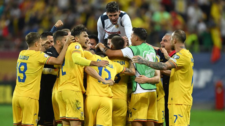 Romania's midfielder #10 Nicolae Stanciu celebrates scoring the opening goal with his teammates during the EURO 2024 first round group I qualifying football match between Romania and Kosovo in Bucharest on September 12, 2023. (Photo by Daniel MIHAILESCU / AFP) (Photo by DANIEL MIHAILESCU/AFP via Getty Images)