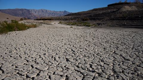 Cracked earth is visible in an area once under the water of Lake Mead at the Lake Mead National Recreation Area on Jan. 27, 2023, near Boulder City, Nevada.