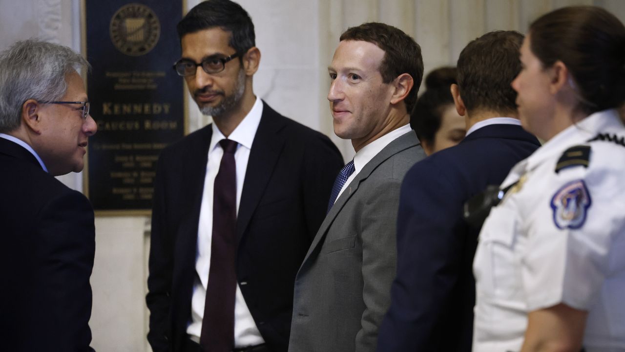 (L-R) NVIDIA CEO Jensen Huang, Google CEO Sundar Pichai and Meta CEO Mark Zuckerberg visit before attending the "AI Insight Forum" outside the Kennedy Caucus Room in the Russell Senate Office Building on Capitol Hill on September 13, 2023 in Washington, DC. Lawmakers are seeking input from business leaders in the artificial intelligence sector, and some of their most ardent opponents, for writing legislation governing the rapidly evolving technology. 