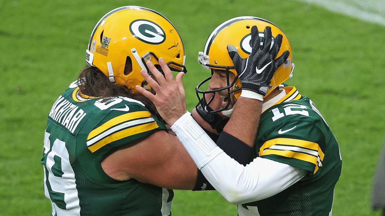 GREEN BAY, WISCONSIN - NOVEMBER 15: Aaron Rodgers #12 of the Green Bay Packers celebrates a touchdown run with David Bakhtiari #69 in the 2nd quarter against the Jacksonville Jaguars at Lambeau Field on November 15, 2020 in Green Bay, Wisconsin. (Photo by Dylan Buell/Getty Images)