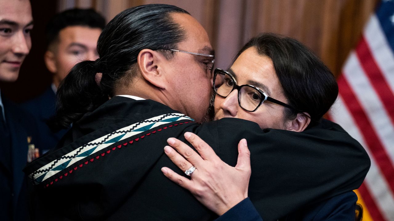 Rep. Mary Peltola hugs her husband Eugene "Buzzy" Petola, during in a swearing-in ceremony at the Capitol on Tuesday, September 13, 2022.