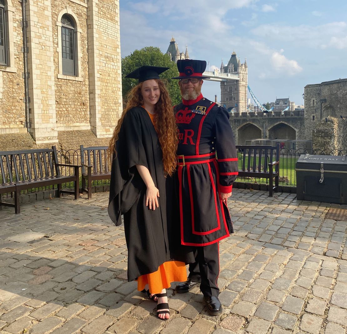Here's Clawson pictured on her college graduation day with her Yeoman Warder dad.